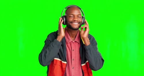 Music, green screen dance and happy black man dancing to headphone song