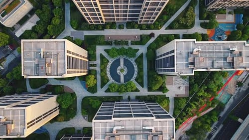 Aerial Top Down View of Modern Residential Area Featuring Greenery Water Features and Recreational