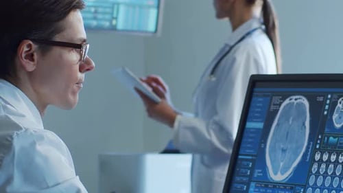 Professional Medical Doctors Working in Hospital Office Making Computer Research Medicine Healthcare