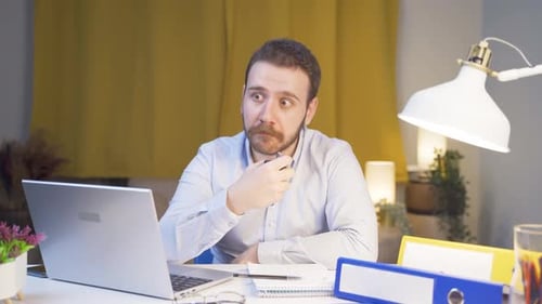 Home office worker sprays perfume on man.