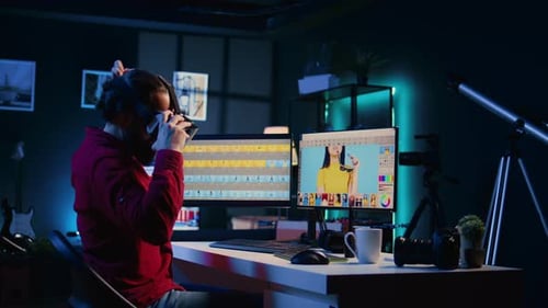 Man Uses VR Headset in Dark Home Office