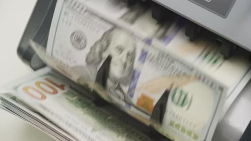 Counting Money with a Modern Currency Counter