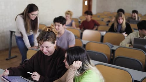 Young people studying inside university classroom - Education concept