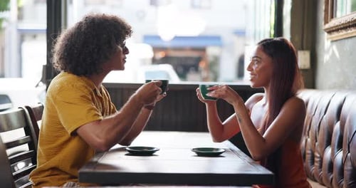 Morning, cheers and couple with coffee in cafe for relax on weekend in restaurant for connection