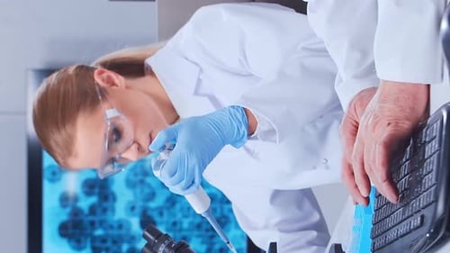 Scientists Work In Modern Laboratory