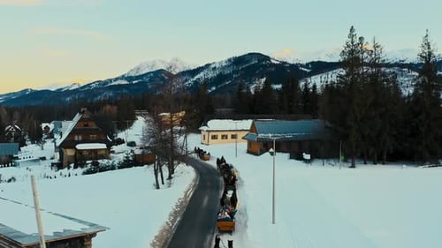Touristic Drone Aerial View of Horse Sleigh Ride in Winter Snow Polish Mountains