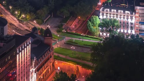 Timelapse of Madrid Royal Palace and Almudena Cathedral at night. Seen from the top of the Hotel RIU