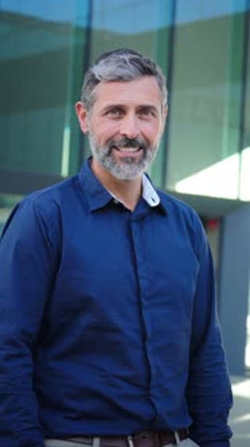 Man Smiling Portrait Outside Modern Building