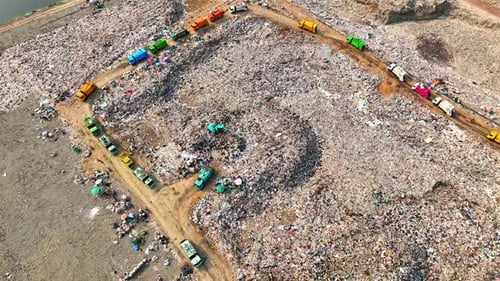 An aerial view over a landfill. 4K.