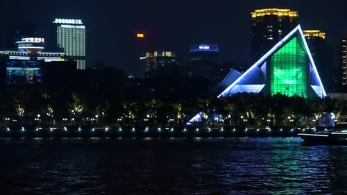 Yiwu, China - May 2018: Urban Scene: Illuminated Panorama Of Dark Night Asian City. River Side An...