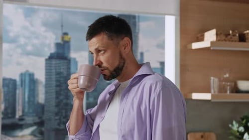 Man Drinking Coffee, City Apartment View