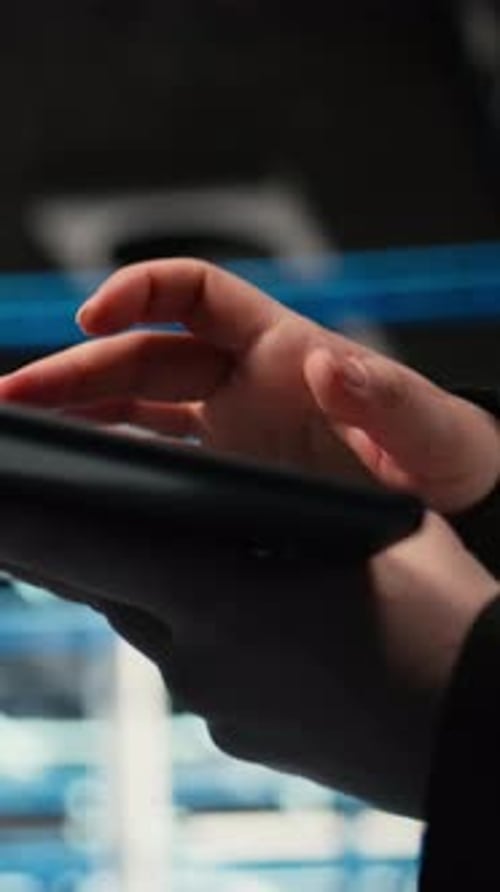 Vertical Video Troubleshooting Tablet Closeup and Admin in Data Center