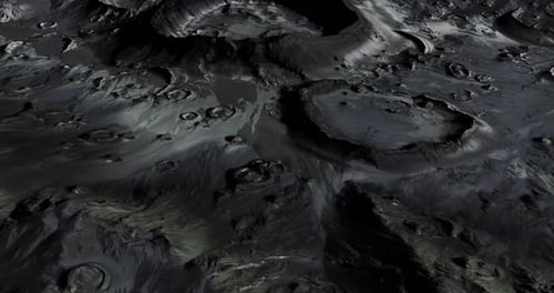 Detailed View of Moons Surface Highlighting Crater Formations and Terrain