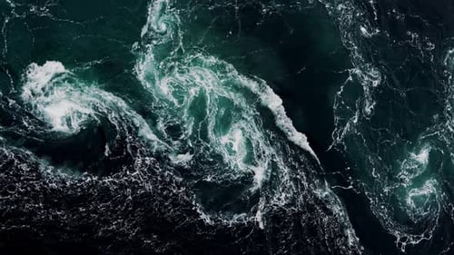 Drone Video with Birdseye View of the Abstract and Powerful Water Currents Rapids and Whirlpools of