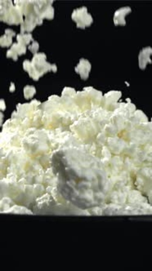 Fresh Cottage Cheese Falls Into the Plate Filmed on a Highspeed Camera at 1000 Fps