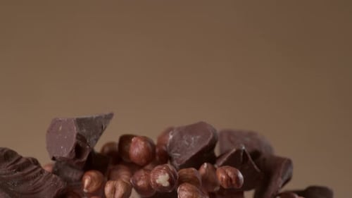 Chocolate Chunks and Hazelnuts Floating in Mid-Air