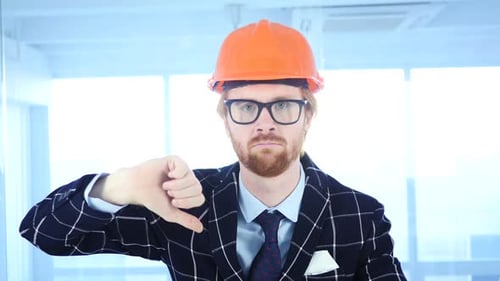 Engineer in Hardhat Gives Thumbs Down Gesture
