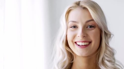 Happy Woman Smiling and Looking at Camera