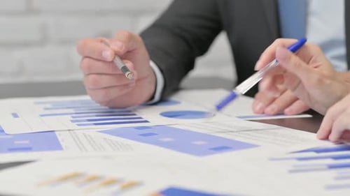 Close up of Business People Hands Working on Documents