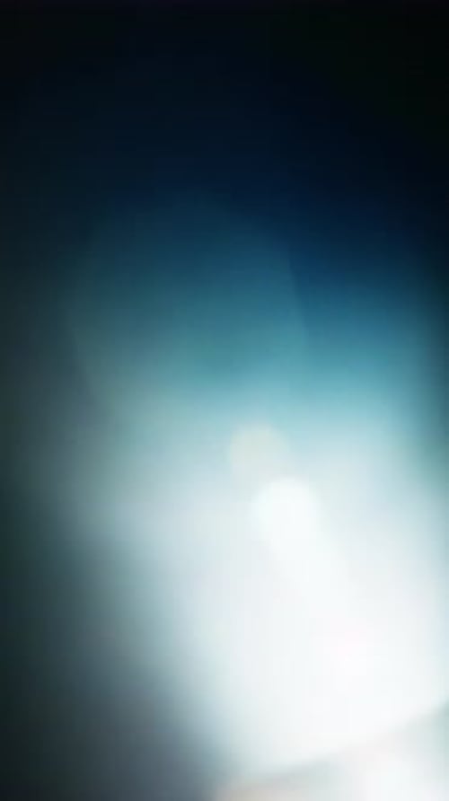 Glowing Light Flare Smoothly Gliding Through The Darkness