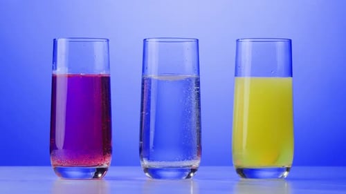 Colorful Fizzy Drinks in Glasses on Blue
