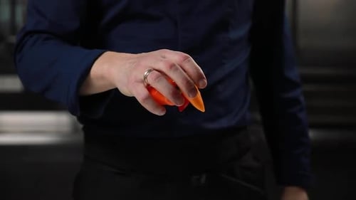 Dropping orange peppers in preparation