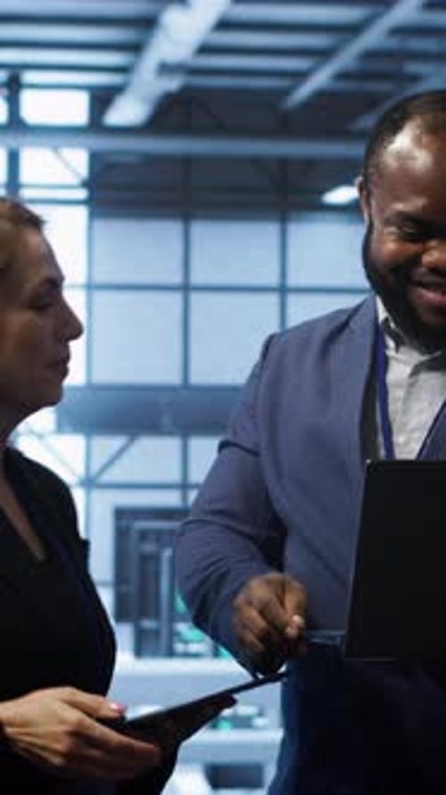 Vertical Video Admin Greeting Inspector Arriving in Data Center to Supervise Operations