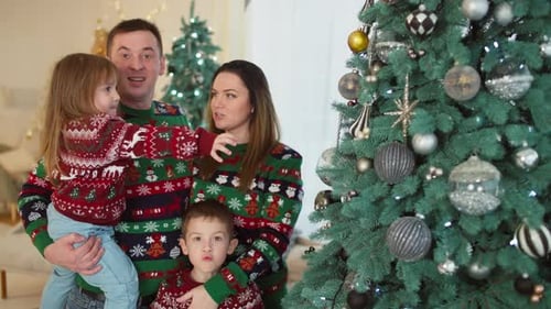 Happy Family Celebrates Christmas Together at Home