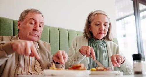 Elderly couple, eating and breakfast in restaurant for love, relationship