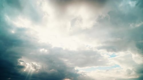 Fluffy Clouds with Sunbeams