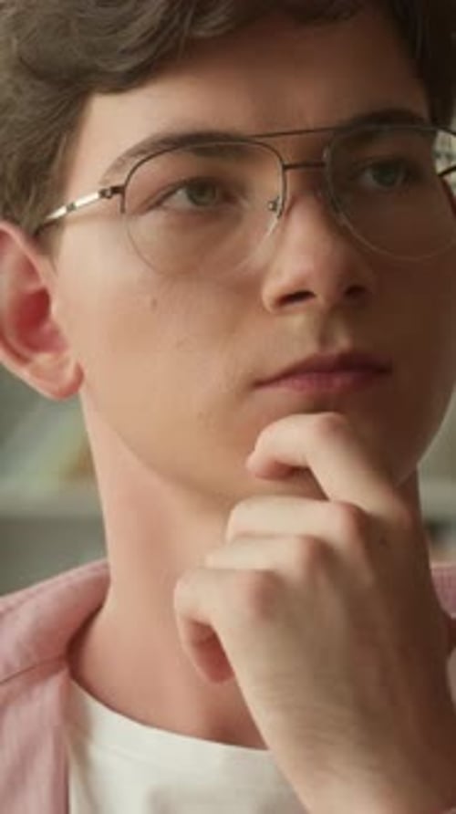 Close Up Portrait Caucasian Teenager Guy Pensive Think School Library Choosing Book Man Looking