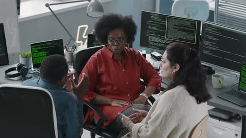 Team of Programmers Communicating in Office