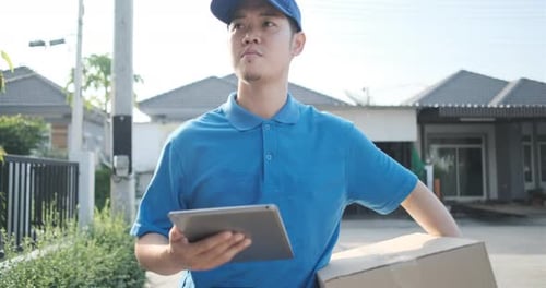 Delivery service male in uniform give cardboard box package walking to receiver customer client