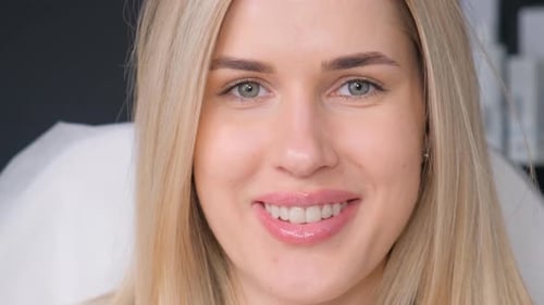 Face Portrait of a Beautiful Blonde Model Looking at the Camera Close Up