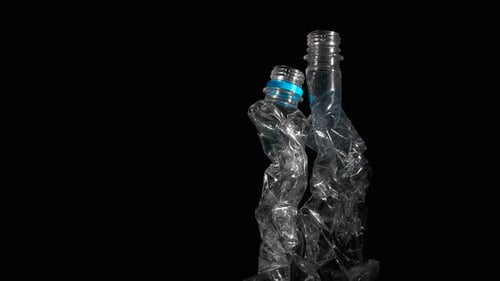 Crumpled Plastic Bottles on Black Background
