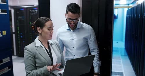 IT Professionals Collaborate in Server Room