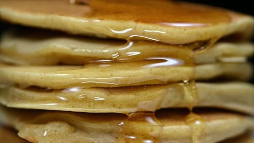 Delicious Stack of Pancakes with Dripping Syrup
