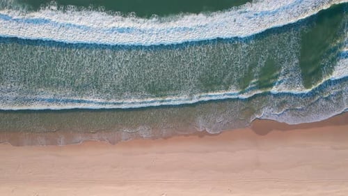 Rippling ocean waves. Aerial view, drone footage, empty beach waves