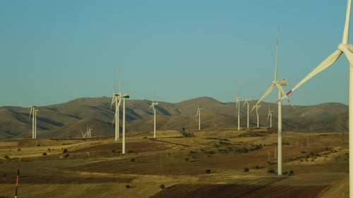 Wind Turbines Rotating in Rural Landscape