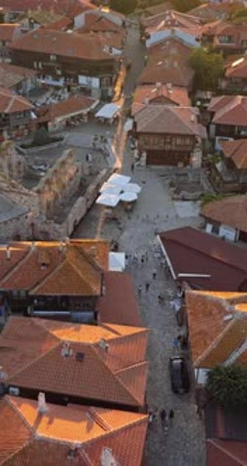 Aerial drone view of the old town Nessebar, Bulgaria at sunset. Vertical