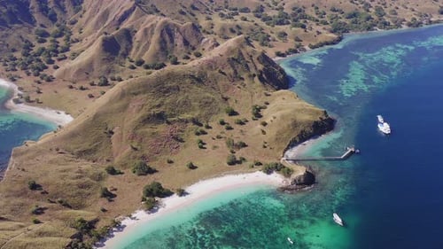 Aerial view of Pink Beach and Coral lined waters of Komodo National Park, Flores, Indonesia.
