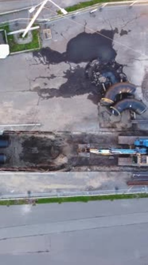 Urban Construction Site Aerial View with Excavator