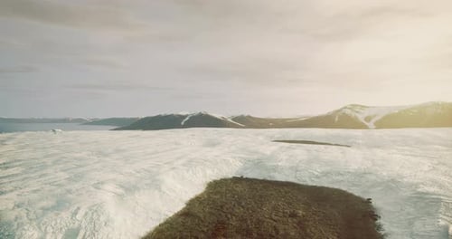 Vast Frozen Landscape Reveals Dramatic Ice and Mountain Formations