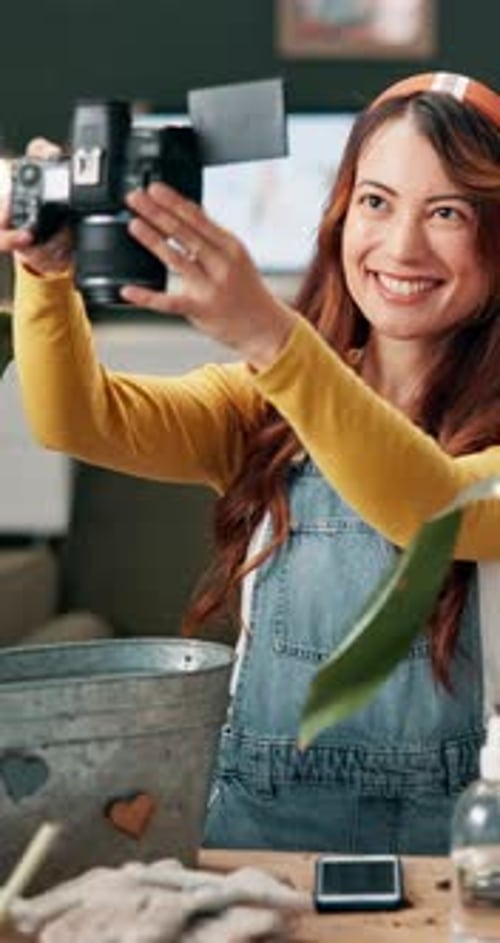 Woman, camera and photography of gardening at house for creative blog, social media post