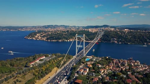 The Fatih Sultan Mehmet Bridge in Istanbul connects two landmasses over the sea.
