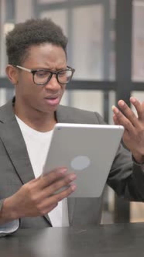 Vertical, Online Loss on Digital Tablet for African American Man