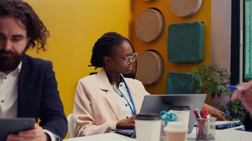 Diverse Professionals Collaborating on Business Projects in Office