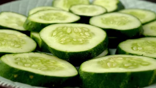 Macro Close-Up of Fresh Cucumber Slices on Plate