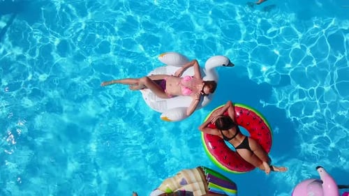 Pool Party: Friends Relaxing on Floats, Summer Vacation