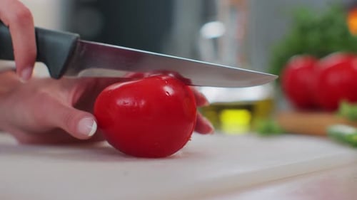Fresh Tomato Being Cut With Knife